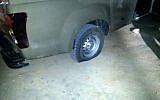 The slashed tire of an IDF vehicle in Yitzhar in the West Bank, Monday, April 7, 2014 (photo credit: Tazpit News Agency)