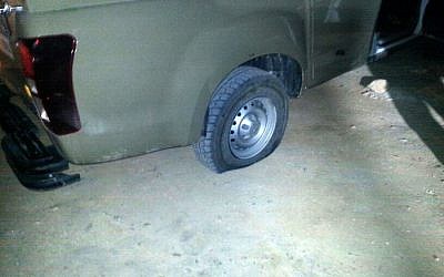 The slashed tire of an IDF vehicle in Yitzhar in the West Bank, Monday, April 7, 2014 (photo credit: Tazpit News Agency)