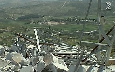 An IDF outpost destroyed by settlers in the West Bank settlement of Yitzhar, April 2014. (screen capture: Channel 2)