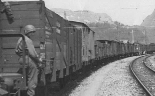 American soldier guards the Hungarian Gold Train in Werfen [Salzburg], Austria, May 1945. (Courtesy National Archives, photo no. 239-PA-1-1-9)