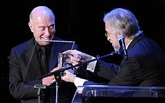 David Geffen, left, accepts the President's Merit Award from the President of the National Academy of Recording Arts and Sciences, on Feb. 12, 2011 in Beverly Hills, Calif. (photo credit: AP/Mark J. Terrill)