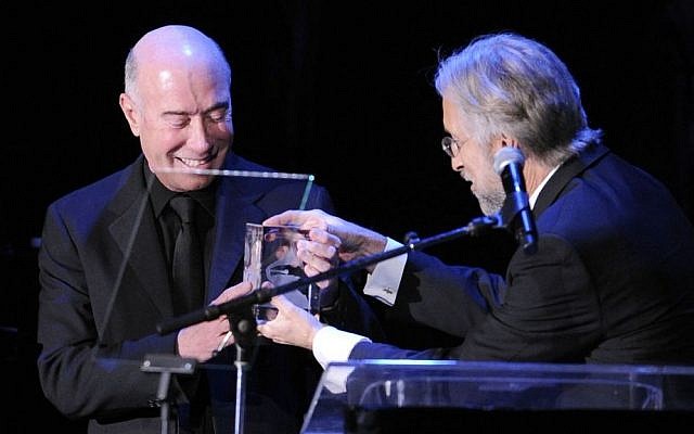 David Geffen, left, accepts the President's Merit Award from the President of the National Academy of Recording Arts and Sciences, on Feb. 12, 2011 in Beverly Hills, Calif. (photo credit: AP/Mark J. Terrill)