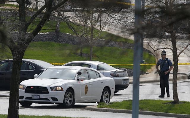 A Kansas State Trooper stands near the location of a shooting at the Jewish Community Center in Overland Park, Kansas, Sunday, April 13, 2014 (photo credit: AP/Orlin Wagner) A Kansas State Trooper stands near the location of a shooting at the Jewish Community Center in Overland Park, Kansas, Sunday, April 13, 2014 (photo credit: AP/Orlin Wagner)