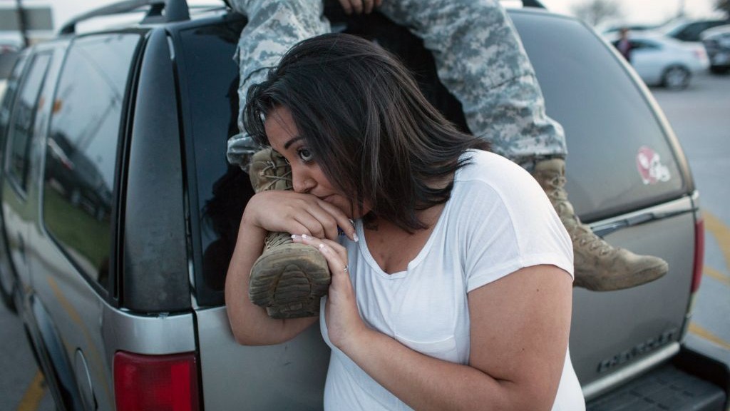 Lucy Hamlin and her husband, Spc. Timothy Hamlin, wait for permission to re-enter the Fort Hood military base, where they live, following a shooting on the base, Wednesday, April 2, 2014, in Fort Hood, Texas. (photo credit: AP/Tamir Kalifa) Lucy Hamlin and her husband, Spc. Timothy Hamlin, wait for permission to re-enter the Fort Hood military base, where they live, following a shooting on the base, Wednesday, April 2, 2014, in Fort Hood, Texas. (photo credit: AP/Tamir Kalifa)
