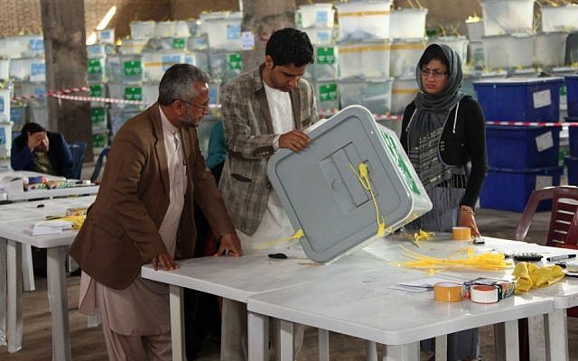 Afghan ballot counters read instructions on how to count and register votes in Herat Province, west of Kabul, Afghanistan, Sunday, April 20, 2014. (AP Photo/Hoshang Hashimi) Afghan ballot counters read instructions on how to count and register votes in Herat Province, west of Kabul, Afghanistan, Sunday, April 20, 2014. (AP Photo/Hoshang Hashimi)