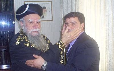 Sait Ali Bayrak receiving a peace medal from Sephardi Chief Rabbi of Israel, Eliyahu Bakshi-Doron, 2003 (Photo courtesy of Sait Ali Bayrak) Sait Ali Bayrak receiving a peace medal from Sephardi Chief Rabbi of Israel, Eliyahu Bakshi-Doron, 2003 (Photo courtesy of Sait Ali Bayrak)