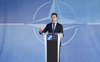 NATO Secretary General Anders Fogh Rasmussen addresses the media at NATO headquarters in Brussels, April 16, 2014. (photo credit: AP/Yves Logghe)