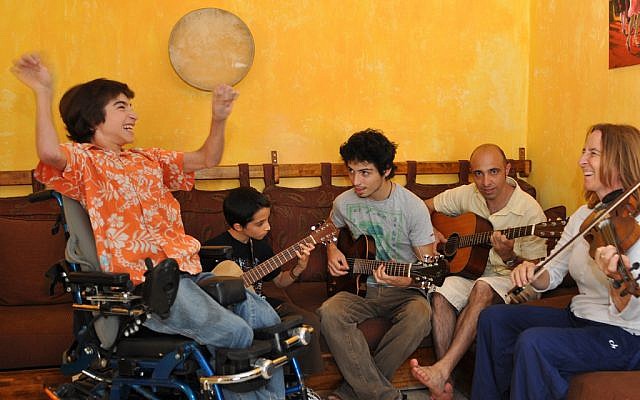 Rotem Elnatan cheers as his brothers, Inbar and Shachar, his father, Zohar, and his mother, Debby, perform. The entire family loves music. (Photo courtesy of Debby Elnatan)