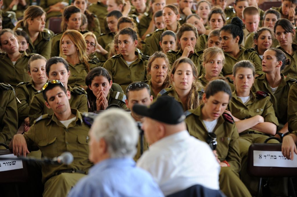 Holocaust survivors, Peter Erben(L) and Yakov Zur, who were football players at Therezienshtadt ghetto league speak with IDF soldiers during Holocaust Martyrs and Heroes Remembrance Day at Beit Theresienstadt Museum in Kibbutz Givat Haim (photo credit: Gili Yaari/Flash 90)