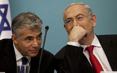 Finance Minister Yair Lapid with Prime Minister Benjamin Netanyahu. (Photo credit: Flash90)