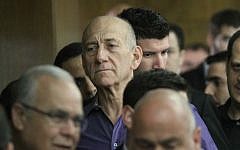 Former prime minister Ehud Olmert in Tel Aviv District Court, March 31, 2014, where he was found guilty of bribe-taking in the Holyland real estate scandal. (photo credit: Ido Erez/Pool/Flash90