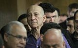 Back to it? Former PM Ehud Olmert was investigated Monday by prosecutors on new charges. In this photo from March 31, 2014, Olmert is in the courtroom where he was found guilty of accepting bribes (photo credit: Ido Erez/POOL/FLASH90)
