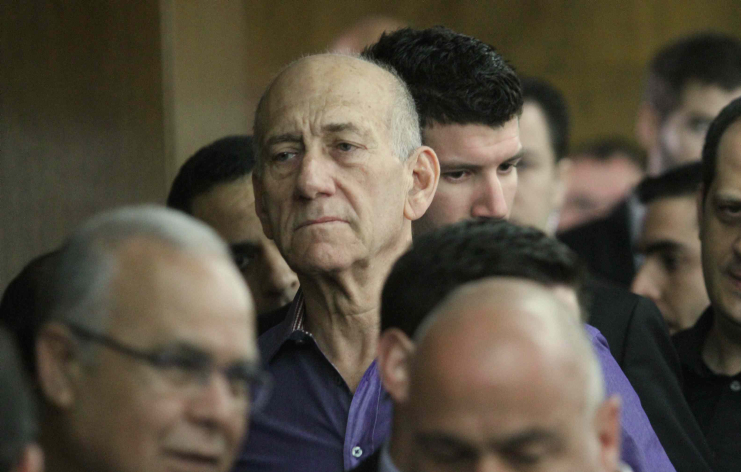 Back to it? Former PM Ehud Olmert was investigated Monday by prosecutors on new charges. In this photo from March 31, 2014, Olmert is in the courtroom where he was found guilty of accepting bribes (photo credit: Ido Erez/POOL/FLASH90) Back to it? Former PM Ehud Olmert was investigated Monday by prosecutors on new charges. In this photo from March 31, 2014, Olmert is in the courtroom where he was found guilty of accepting bribes (photo credit: Ido Erez/POOL/FLASH90)