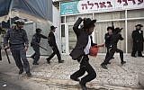 Illustrative: Ultra-Orthodox Jews and police, in a protest against a national military draft bill, Jerusalem, April 10, 2014. (Yonatan Sindel/Flash90/File)