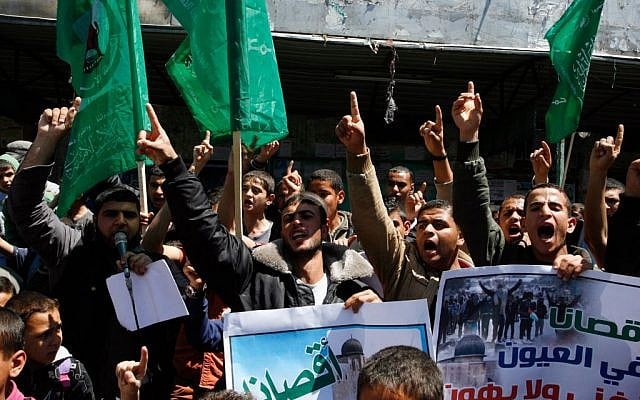 Gazans waving Hamas flags at a rally on Monday, April 14, 2014. (photo credit: Abed Rahim Khatib/Flash90) Gazans waving Hamas flags at a rally on Monday, April 14, 2014. (photo credit: Abed Rahim Khatib/Flash90)