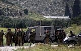 Illustrative: Israeli troops on alert in the West Bank following a fatal shooting attack on Passover eve on Route 35, near Hebron, Tuesday, April 15, 2014. (photo credit: Issam Rimawi/Flash90)