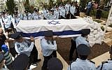 Israeli police officers carry the coffin of Baruch Mizrahi during the funeral at the military cemetery of Mount Herzl in Jerusalem on April 16, 2014. (photo credit: Yonatan Sindel/Flash90)