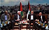 Senior Hamas leader Moussa Abu Marzouk (left) senior Fatah official Azzam Al-Ahmad (second left), head of the Hamas government Ismail Haniyeh (second right) and deputy speaker of the Palestinian Parliament Ahmed Bahar (right) attend a meting in Gaza City on April 22, 2014. (photo credit: Abed Rahim Khatib/Flash90)