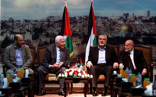 Senior Hamas leader Moussa Abu Marzouk (left) senior Fatah official Azzam Al-Ahmad (second left), head of the Hamas government Ismail Haniyeh (second right) and deputy speaker of the Palestinian Parliament Ahmed Bahar (right) attend a meting in Gaza City on April 22, 2014. (photo credit: Abed Rahim Khatib/Flash90) Senior Hamas leader Moussa Abu Marzouk (left) senior Fatah official Azzam Al-Ahmad (second left), head of the Hamas government Ismail Haniyeh (second right) and deputy speaker of the Palestinian Parliament Ahmed Bahar (right) attend a meting in Gaza City on April 22, 2014. (photo credit: Abed Rahim Khatib/Flash90)