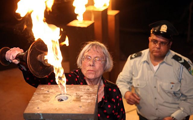 Former Supreme Court justice Dalia Dorner light a torch during a ceremony at Kibbutz Tel Yitzhak, as Israel marks the annual Holocaust Remembrance Day on April 27, 2014. (photo credit: Gideon Markowicz/Flash90)