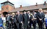 On the right path. Participants march from Auschwitz to Birkenau in the March of the Living in Poland on Monday. Leading the March are Supreme Court Justice Asher Gronis (center left) and former chief rabbi of Yisrael Meir Lau (center right) march of the living in Poland (photo credit: Yossi Zeliger/FLASH90)