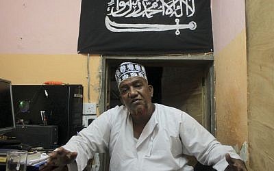 Abubakar Shariff Ahmed sits in his office in Mombasa, Kenya, on Oct. 29, 2013 (photo credit: AP/Jason Straziuso)