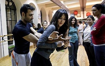 A self-defense class for women in Cairo in 2013. (photo credit: AP Photo/Maya Alleruzzo)