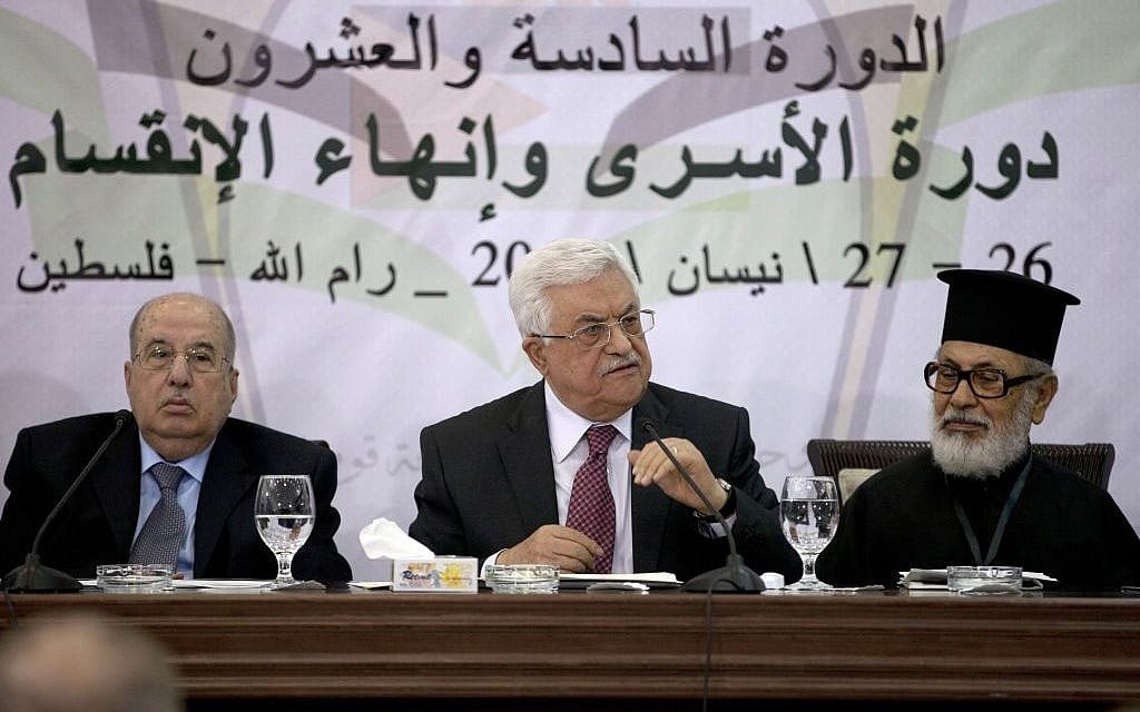 Palestinian Authority President Mahmoud Abbas speaks during a meeting of the Palestinian Central Council, a top decision-making body, at his headquarters in the West Bank city of Ramallah, Saturday, April 26, 2014. Abbas said any unity government with the Islamic extremist Hamas would follow his political program, an apparent attempt to reassure the West. Israel’s leaders have accused Abbas of choosing Hamas over possible peace with Israel. (photo credit: AP Photo/Majdi Mohammed) Palestinian Authority President Mahmoud Abbas speaks during a meeting of the Palestinian Central Council, a top decision-making body, at his headquarters in the West Bank city of Ramallah, Saturday, April 26, 2014. Abbas said any unity government with the Islamic extremist Hamas would follow his political program, an apparent attempt to reassure the West. Israel’s leaders have accused Abbas of choosing Hamas over possible peace with Israel. (photo credit: AP Photo/Majdi Mohammed)