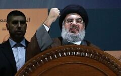 Slain Hezbollah chief Hassan Nasrallah speaks during a rally to mark Jerusalem day, or Al-Quds day, in the southern suburb of Beirut, Lebanon, August 2, 2013. (AP Photo/Hussein Malla)