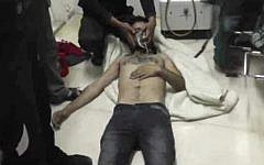 In this Friday, April 11, 2014 image made from amateur video, provided by Shams News Network, a loosely organized anti-Assad group based in and out of Syria that claim not to have any connection to Syrian opposition parties or any other states, and is consistent with independent AP reporting, shows a man as he lies on the floor with an oxygen mask at a hospital room in Kfar Zeita, some 200 kilometers (125 miles) north of Damascus, Syria. (photo credit: AP/Shams News Network)