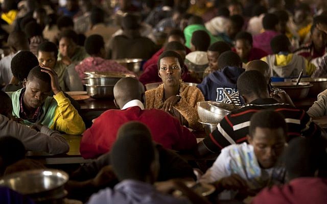 Students have lunch in the cafeteria at the Agahozo-Shalom Youth Village near Rwamagana, in Rwanda, March 2014. (AP Photo/Ben Curtis)