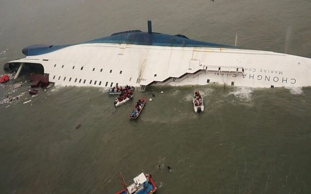 South Korean rescue team boats and fishing boats try to rescue passengers of a ferry sinking off South Korea's southern coast, south of Seoul, April 16, 2014. (photo credit: AP/South Korea Coast Guard via Yonhap)