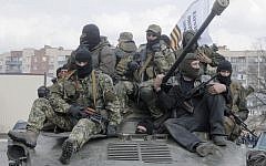 A combat vehicle with pro-Russian gunman on top drives through Slovyansk Wednesday, April 16, 2014.  (photo credit:AP/Efrem Lukatsky)
