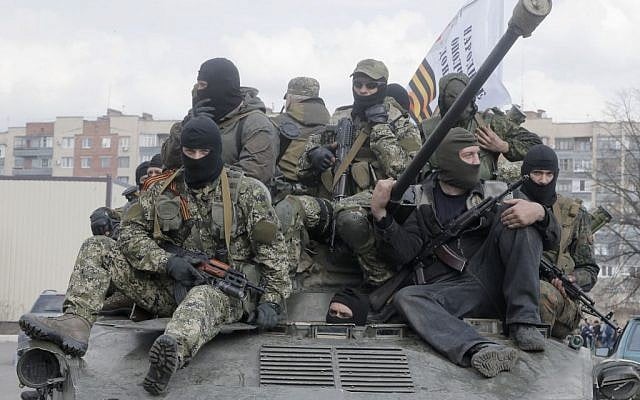 A combat vehicle with pro-Russian gunman on top drives through Slovyansk Wednesday, April 16, 2014. (photo credit:AP/Efrem Lukatsky) A combat vehicle with pro-Russian gunman on top drives through Slovyansk Wednesday, April 16, 2014. (photo credit:AP/Efrem Lukatsky)