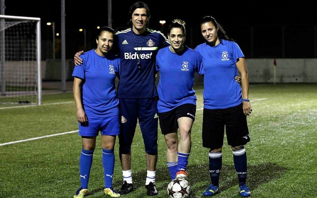 From left to right, Israeli Arab players Hanin Gamal Nasser, Walaa Hussien and Noura Abu-Shanab pose with their coach during a practice session in Petah Tikva, Israel. (AP Photo/Tsafrir Abayov) From left to right, Israeli Arab players Hanin Gamal Nasser, Walaa Hussien and Noura Abu-Shanab pose with their coach during a practice session in Petah Tikva, Israel. (AP Photo/Tsafrir Abayov)
