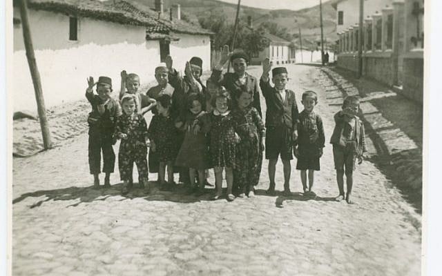 Jewish children in Mlawa, Poland,  told to pose while giving a Nazi salute to entertain German soldiers. (photo credit: Shem Olam Institute)