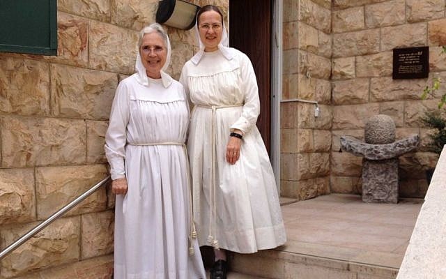 Sister Gratia (left) and Sister Yahalom in front of Beit Avraham at 10 Ein Gedi Street in Jerusalem. (photo credit: Renee Ghert-Zand)