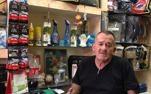 Hassan Siam in his office on Bethlehem Road (photo credit: Mitch Ginsburg/ Times of Israel)