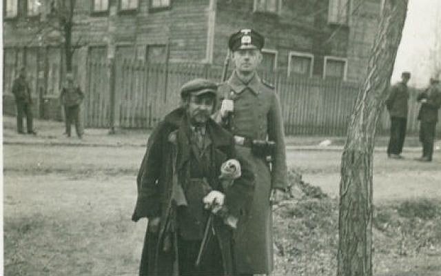 A German soldier poses next to a Jewish man (photo credit: Shem Olam Institute)