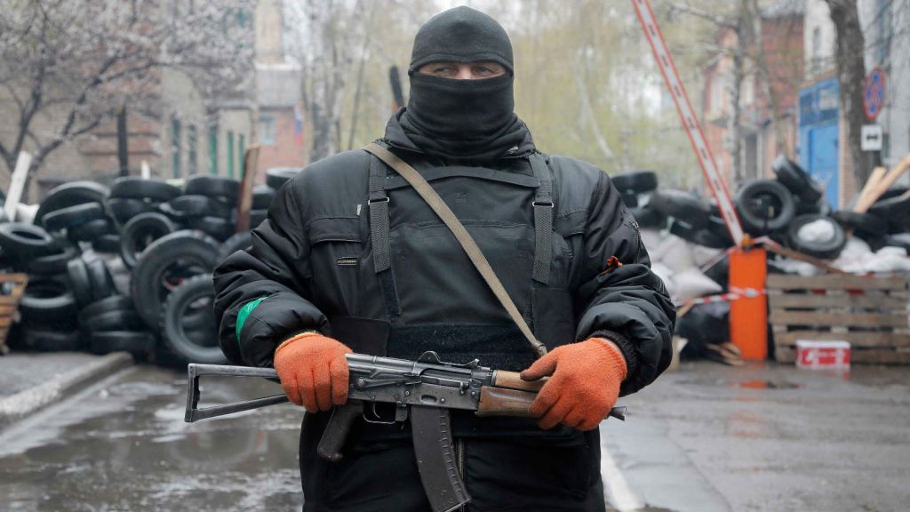 A pro-Russian gunman stands guard at a seized police station in the eastern Ukraine town of Slovyansk. (photo credit: AP Photo/Efrem Lukatsky) A pro-Russian gunman stands guard at a seized police station in the eastern Ukraine town of Slovyansk. (photo credit: AP Photo/Efrem Lukatsky)