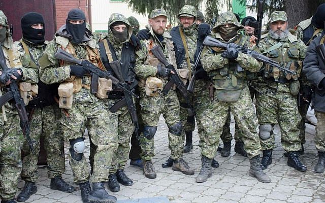 Armed pro-Russian activists pose for a photo after they occupied the police station in the eastern Ukraine town of Slovyansk. (photo credit: AP/Maxim Dondyuk, Russian Reporter magazine) Armed pro-Russian activists pose for a photo after they occupied the police station in the eastern Ukraine town of Slovyansk. (photo credit: AP/Maxim Dondyuk, Russian Reporter magazine)