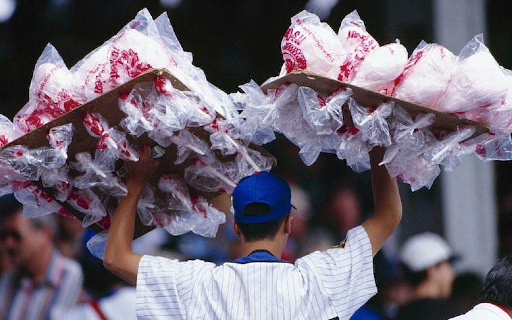 A cotton candy vendor roams the Wrigley Field stands in 1994. (Jonathan Daniel/Getty Images via JTA) A cotton candy vendor roams the Wrigley Field stands in 1994. (Jonathan Daniel/Getty Images via JTA)