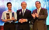 Eitan Amos (L), winner of the 2014 Bible Quiz, poses with Prime Minister Benjamin Netanyahu and Education Minister Shai Piron. (photo credit: GPO)