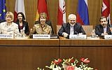 (L-R) EU Deputy Secretary General Helga Schmid, President of the European Commission Catherine Margaret Ashton, Iranian Foreign Minister Mohammad Javad Zarif, and Iranian ambassador to Austria Hassan Tajik attend the P5+1 with Iran at the UN headquarters in Vienna, Wednesday, May 14, 2014. (photo credit: Dieter Nagl/AFP)