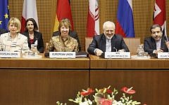 (L-R) EU Deputy Secretary General Helga Schmid, President of the European Commission Catherine Margaret Ashton, Iranian Foreign Minister Mohammad Javad Zarif, and Iranian ambassador to Austria Hassan Tajik attend the P5+1 with Iran at the UN headquarters in Vienna, Wednesday, May 14, 2014. (photo credit: Dieter Nagl/AFP)