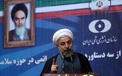 Iranian President Hassan Rouhani delivers a speech during a ceremony at the Iran's Atomic Energy Organization (AEOI) in Tehran on May 11, 2014.  (photo credit: AFP/HO/ PRESIDENCY WEBSITE)