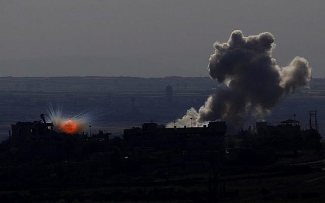 A picture taken on May 11, 2014 from the Israeli-annexed Golan Heights shows smoke billowing from an explosion during clashes between rebels and Syrian pro-government forces in the Syrian town of al-Kahtaniyya. (photo credit:AFP/Jalaa Marey) A picture taken on May 11, 2014 from the Israeli-annexed Golan Heights shows smoke billowing from an explosion during clashes between rebels and Syrian pro-government forces in the Syrian town of al-Kahtaniyya. (photo credit:AFP/Jalaa Marey)