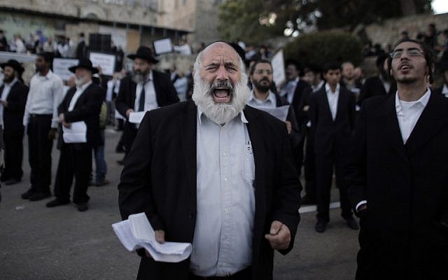 Ultra-Orthodox Jewish men protest against Pope Francis' upcoming visit to the Holy Land, on May 12, 2014 in the Old City of Jerusalem, near King David's tomb. (photo credit: AFP PHOTO/ AHMAD GHARABLI) Ultra-Orthodox Jewish men protest against Pope Francis' upcoming visit to the Holy Land, on May 12, 2014 in the Old City of Jerusalem, near King David's tomb. (photo credit: AFP PHOTO/ AHMAD GHARABLI)