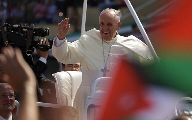 Pope Francis waves to pilgrims upon his arrival at the Amman stadium where he will celebrate a mass on May 24, 2014 in the Jordanian capital. (photo credit: Patrick Baz/AFP) Pope Francis waves to pilgrims upon his arrival at the Amman stadium where he will celebrate a mass on May 24, 2014 in the Jordanian capital. (photo credit: Patrick Baz/AFP)