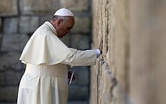 Pope Francis prays at the Western Wall, Judaism's holiest site, in Jerusalem's Old City on May 26, 2014. (photo credit: AFP/Thomas Coex)